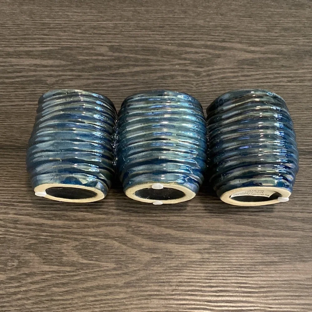 Decorative  clay, metallic blue container. 3 combined vases/cups.